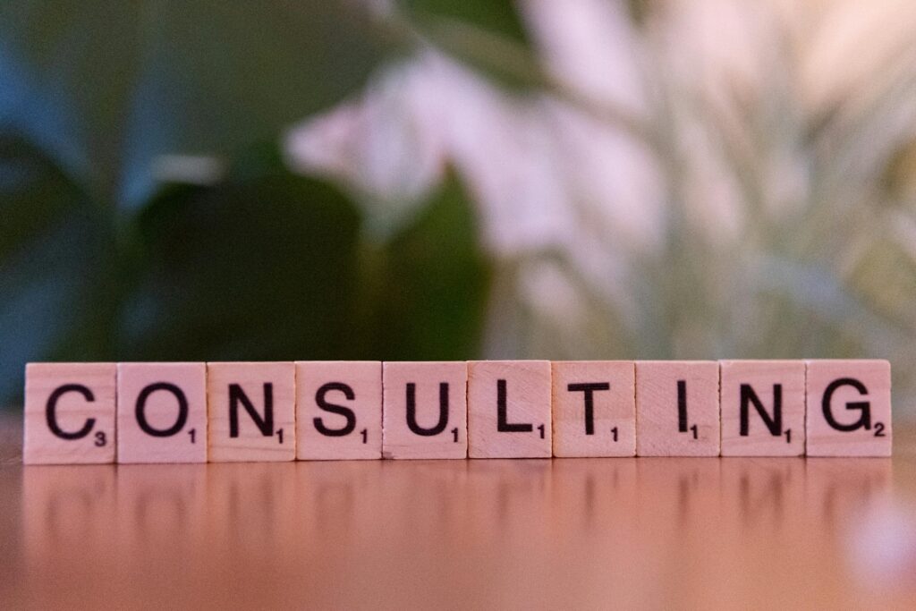 pexels photo 30945515 30945515 Wooden letter tiles spelling 'Consulting' with a blurred background. Ideal for business concepts.